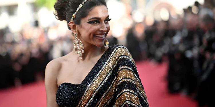 Cannes: Deepika walks the red carpet in a black and golden Sabyasachi sari
