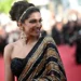 Cannes: Deepika walks the red carpet in a black and golden Sabyasachi sari