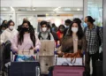 China to resume issuing passports, visas as virus curbs ease